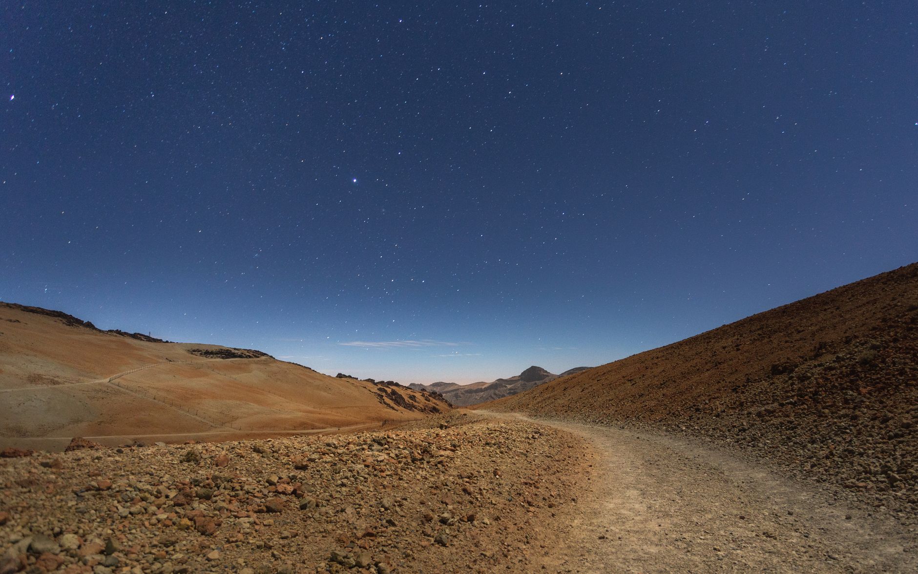Explore the starry skies and barren landscapes of Teide National Park at night.